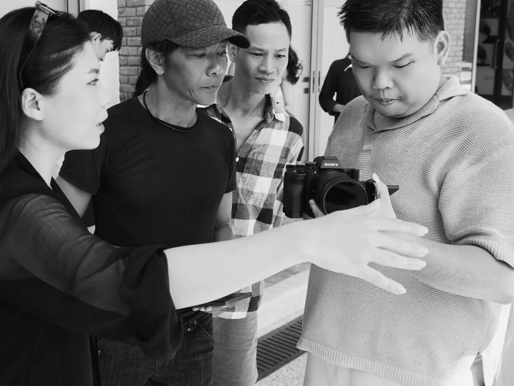 Team Reviewing Camera